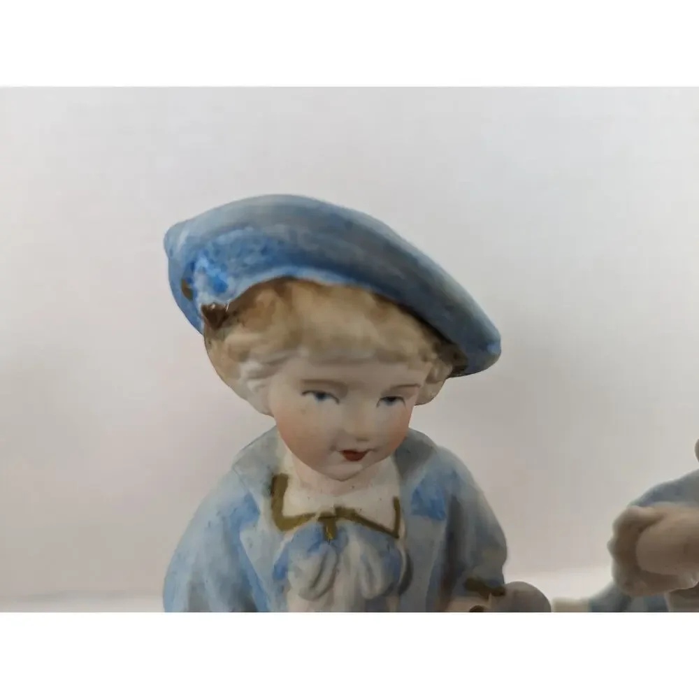 Vintage L & M INC. 8 1/2 '' TALL SET OF TWO BISQUE FIGURINES BOY & GIRL IN BLUE